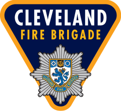 a triangle sign with a lion and a fire brigade emblem